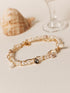 Bracelet grigri en perles de culture blanches et rosées avec cristal Swarovski noir, chaîne plaqué or 24 carats – Gisel B