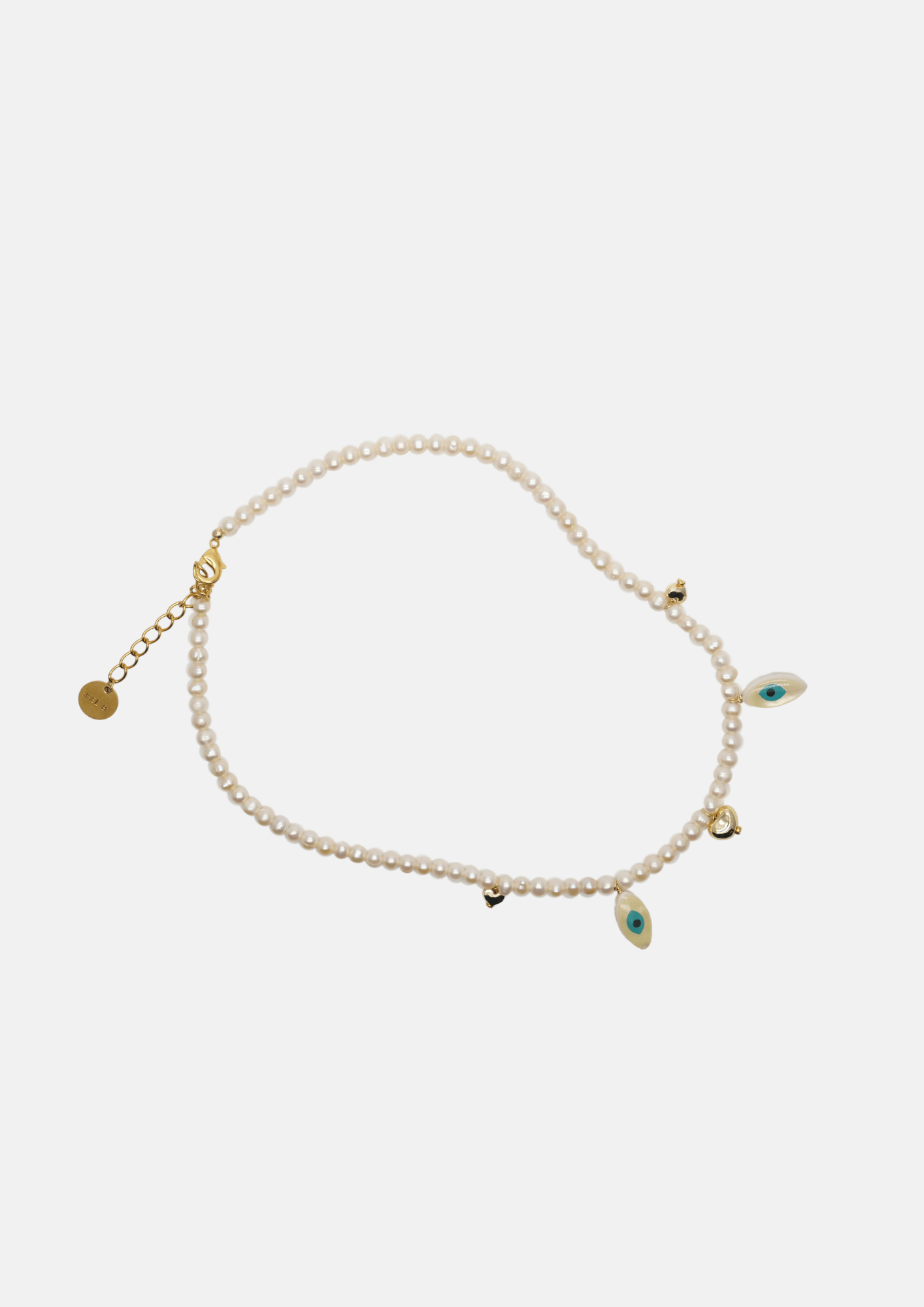Collier grigri Chipote pas x Gisel B en perles de culture rondes et nacre œil protecteur